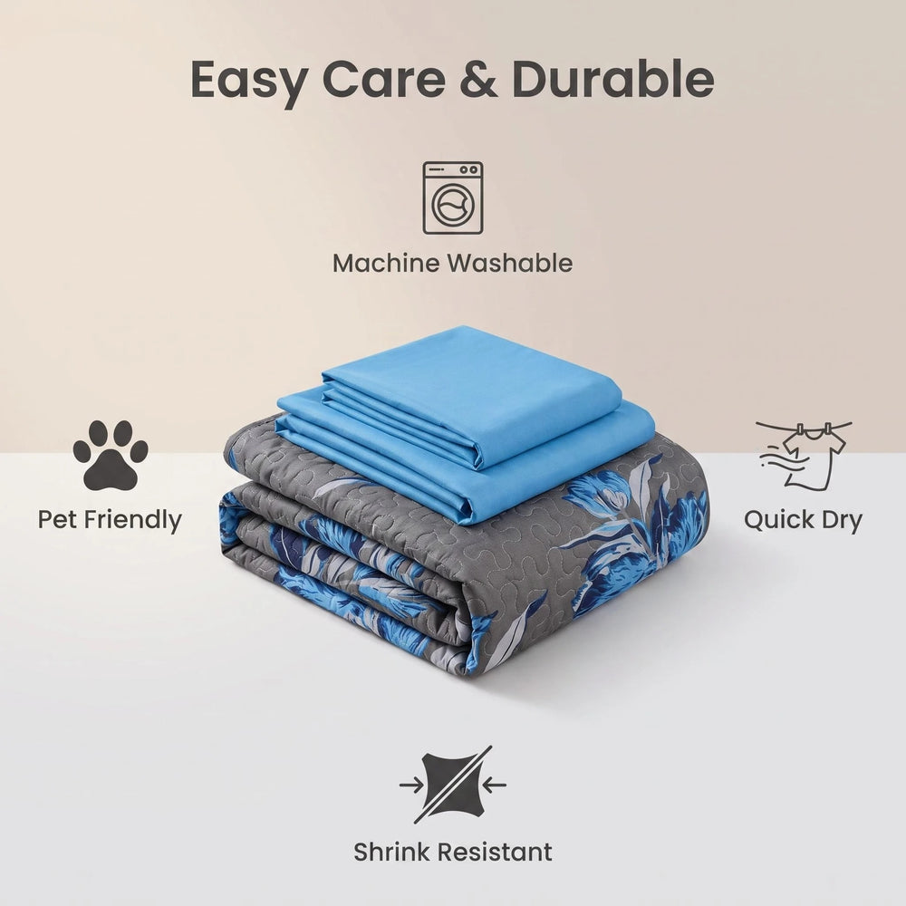 Folded bedspread showing its printed front and solid reverse, with machine-washable, wrinkle-resistant and quick-drying care features
